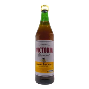 Botella de Grappa Miel Victoria 935ml. Bebida tradicional uruguaya ideal para compartir en reuniones y entrar en calor.