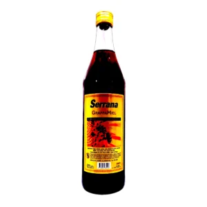 Botella de 925mL de Grappa Miel SERRANA, bebida tradicional uruguaya.